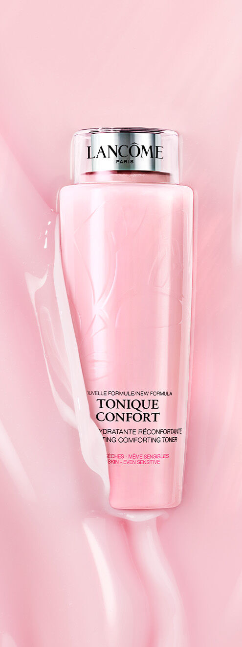 Eine Flasche des Lancome Hydratante Mikronisierende Tonic in einem rosa Hintergrund.